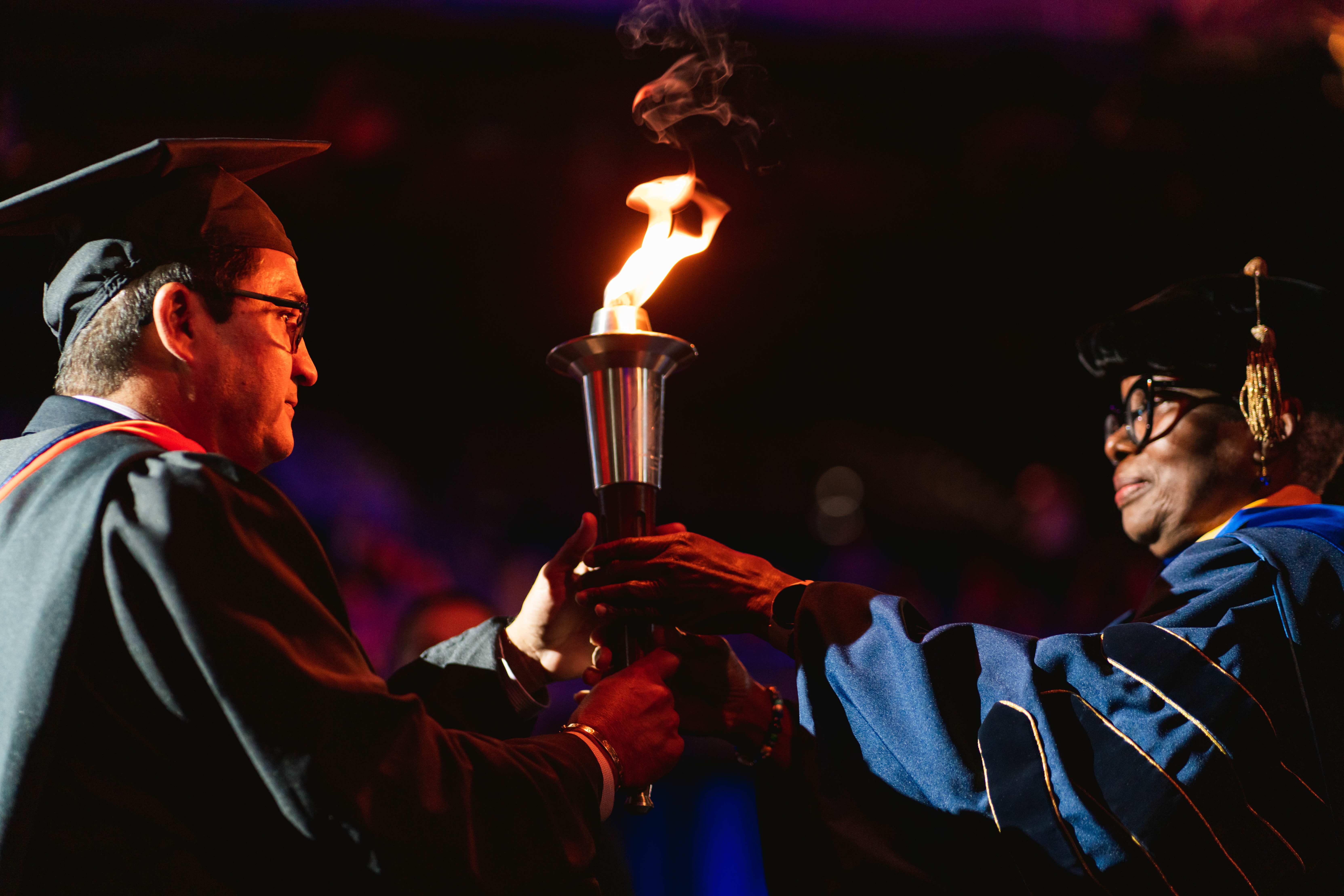 convocation flame being transferred to Ernesto